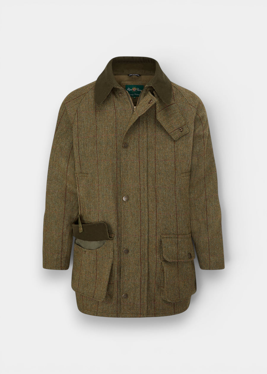 Rutland Men’s Tweed Waterproof Shooting Coat in Oakley, featuring a green collar, front pockets, and a buttoned storm flap.