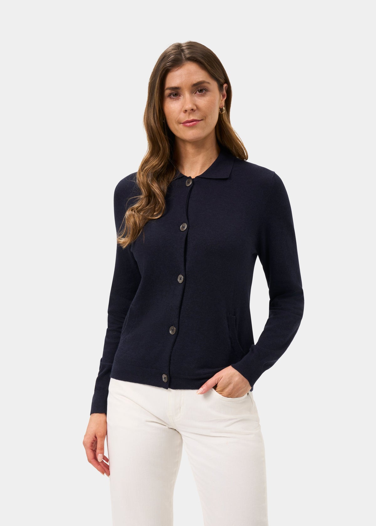 Womens Cardigan in navy blue knit with button front and collar, worn with light trousers