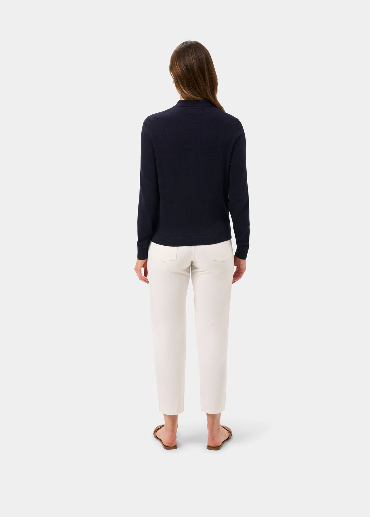 Womens cardigan in navy knit with a high neck and long sleeves, worn with cream trousers