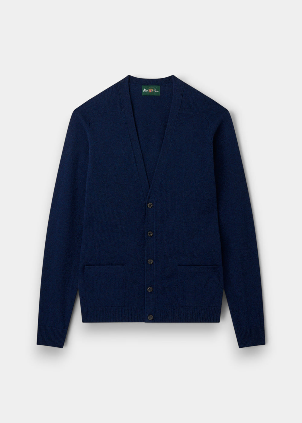 Cornwall Lambswool V-Neck Cardigan in Indigo, classic fit, long sleeves, two pockets, laid flat on light background.