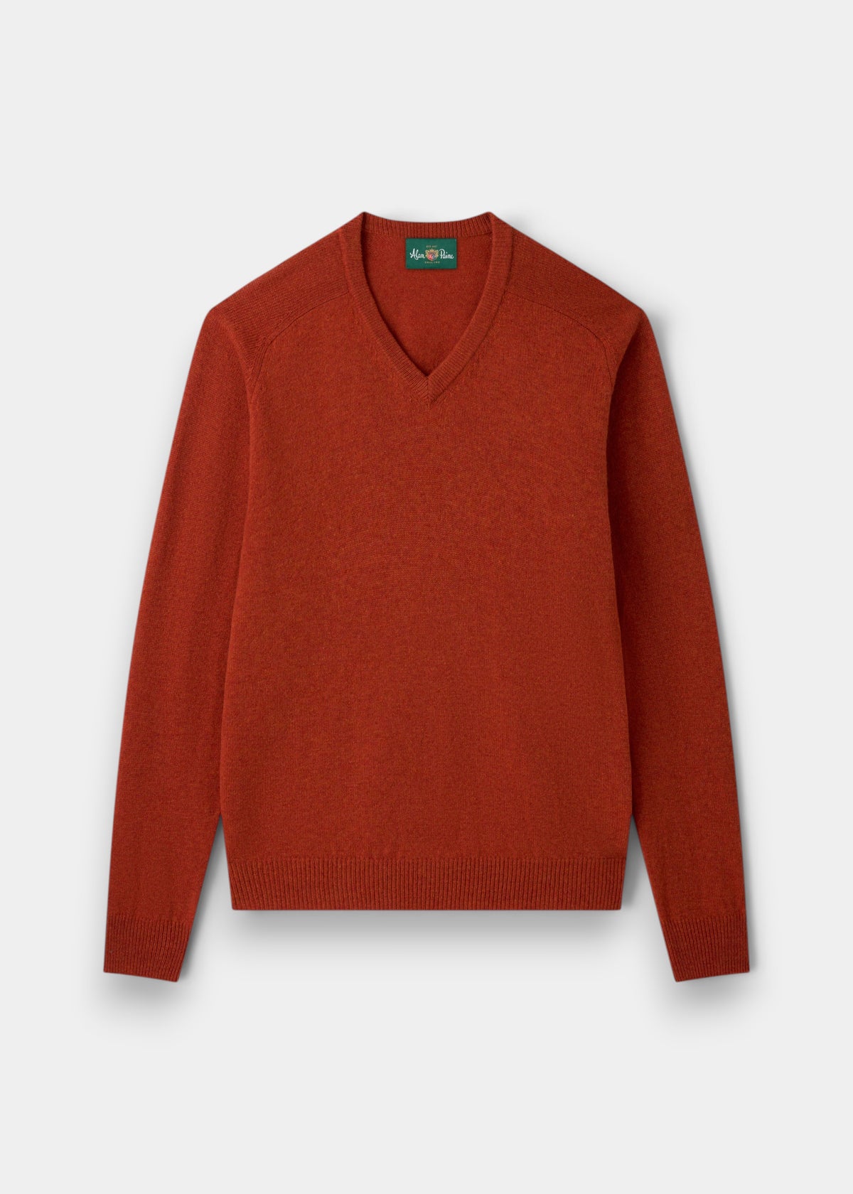 Alan Paine Kilsyth V-neck jumper in ember orange lambswool with ribbed hem and cuffs and saddle shoulder detailing.