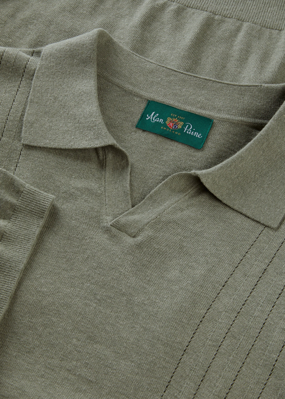 Alan Paine landscape green wool-linen-silk blend polo shirt with an open collar and fine gauge knit texture.