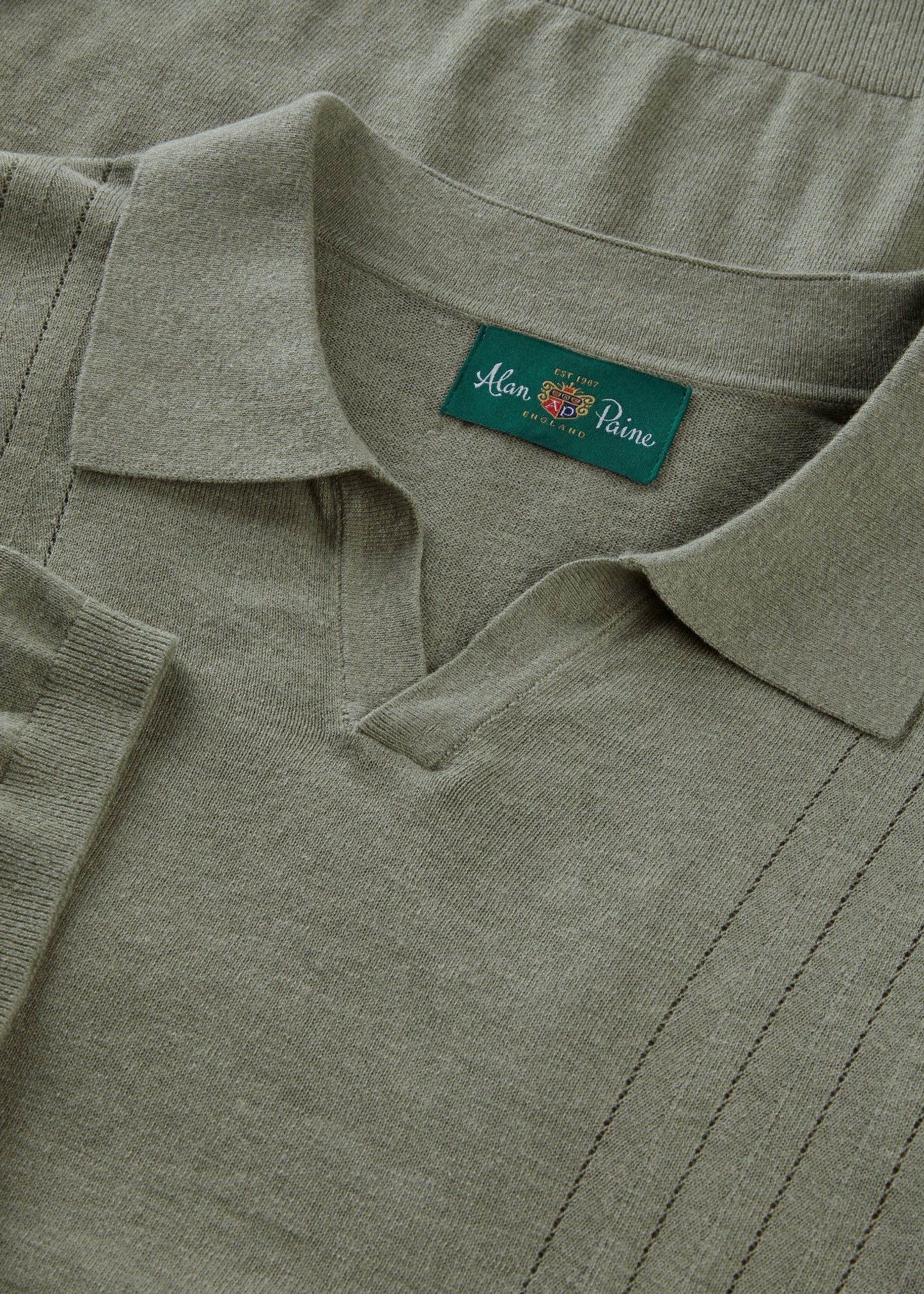 Alan Paine landscape green wool-linen-silk blend polo shirt with an open collar and fine gauge knit texture.