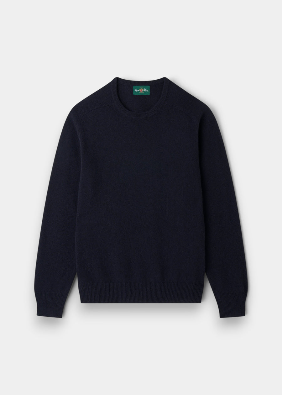 Lenzie Lambswool Crew Neck Jumper in navy, regular fit, long sleeves, laid flat on a light gray background.