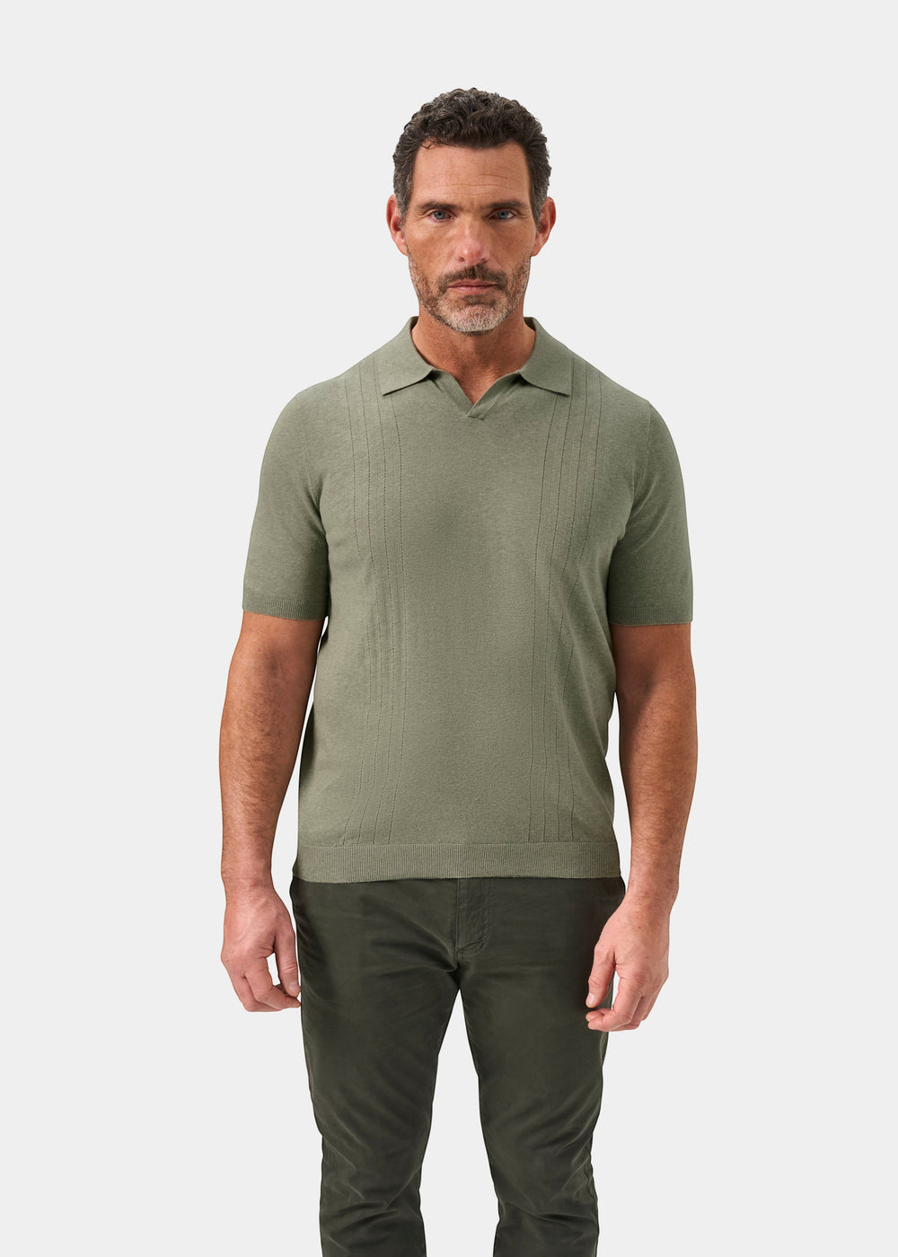Alan Paine Shipford landscape green short sleeve polo shirt in a wool linen silk blend worn by a male model