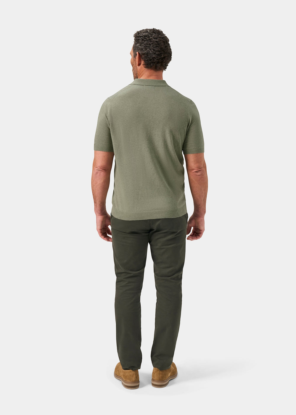 Alan Paine Shipford men's short sleeve polo shirt in landscape green wool-linen-silk blend, back view on a model.