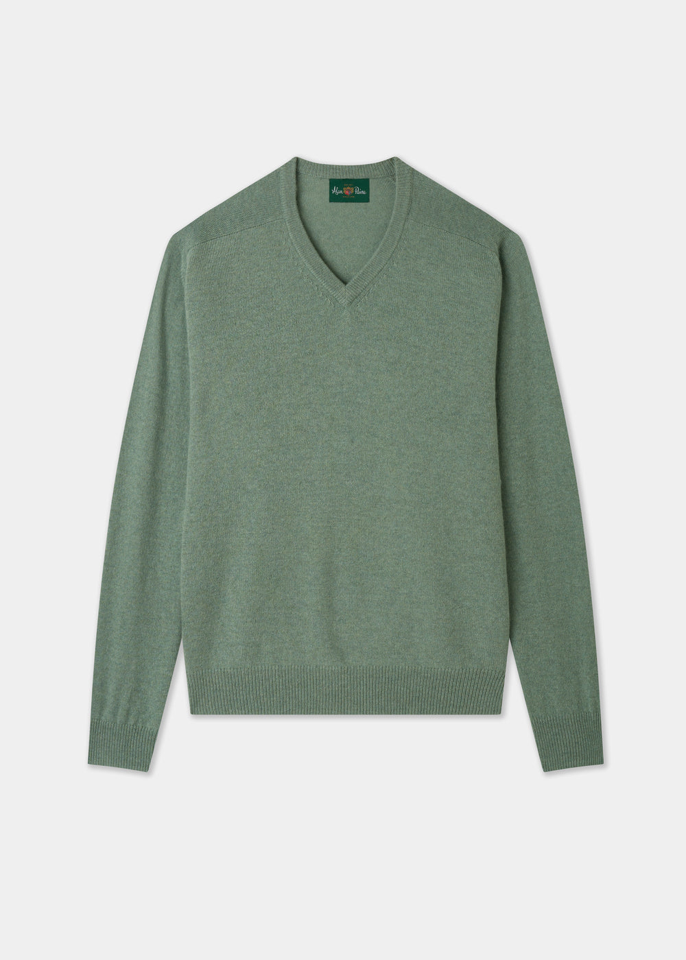 Green sweater on a light gray background