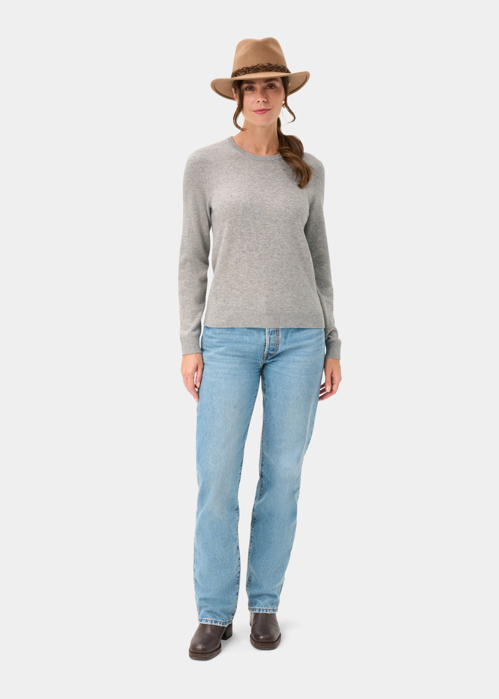 Woman in tan hat, blue jeans, and boots models Ivy Wool & Cashmere Crew Neck Jumper In Husky for a chic look.