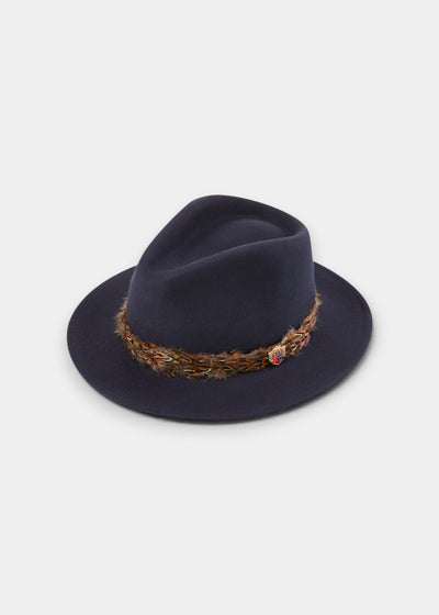 Navy fedora hat in 100 wool felt with formed brim and decorative pheasant feather wrap